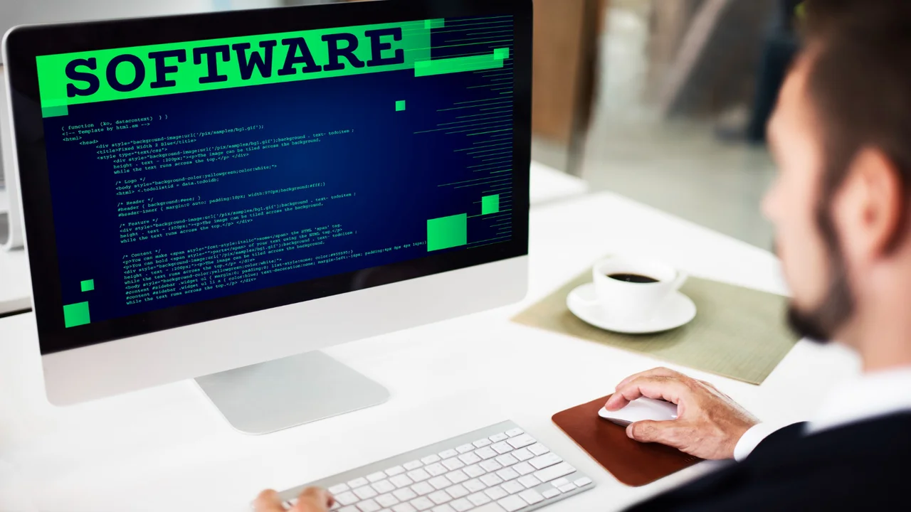 software developer works on pc